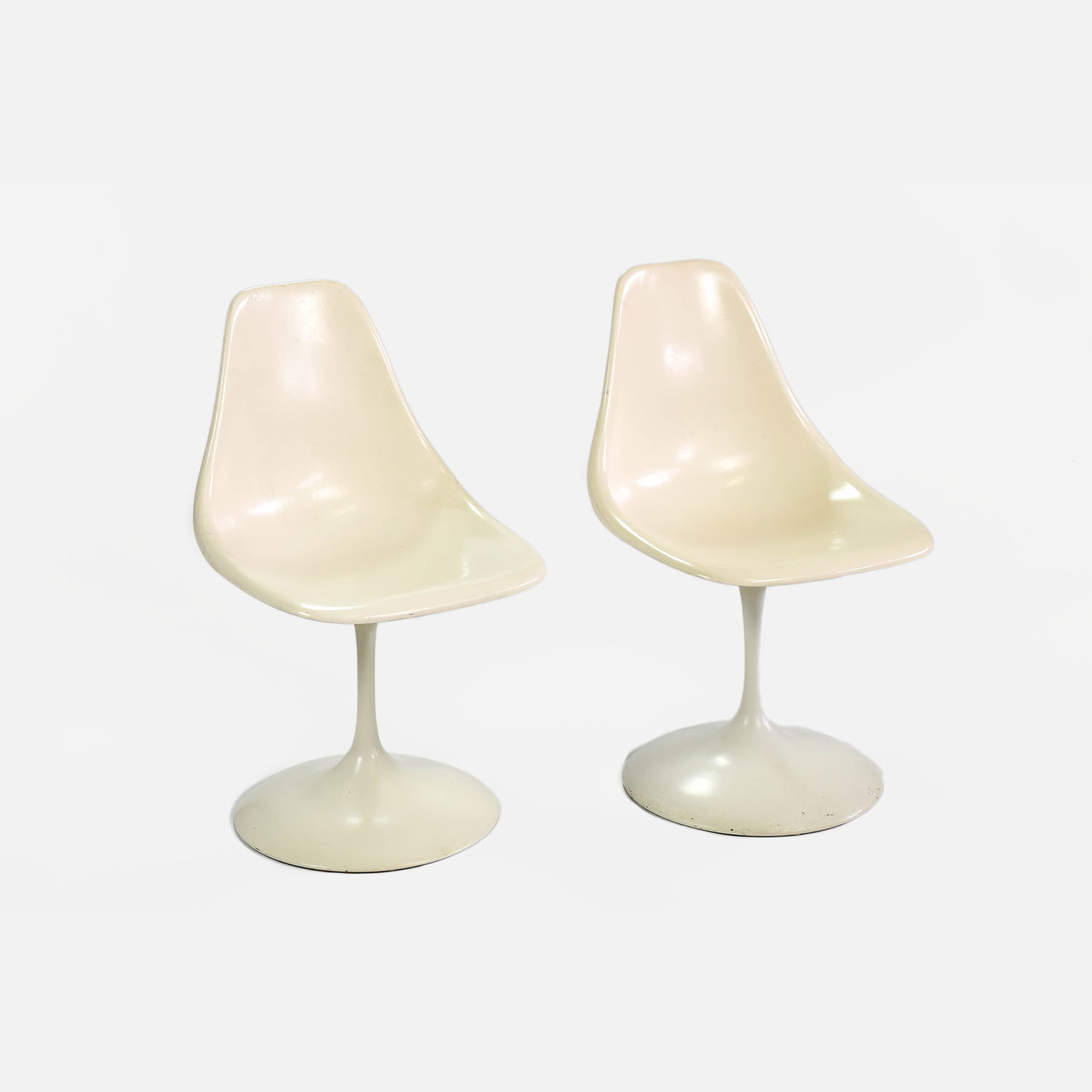 Two 1960s MCM White Tulip Swivel Side Chairs