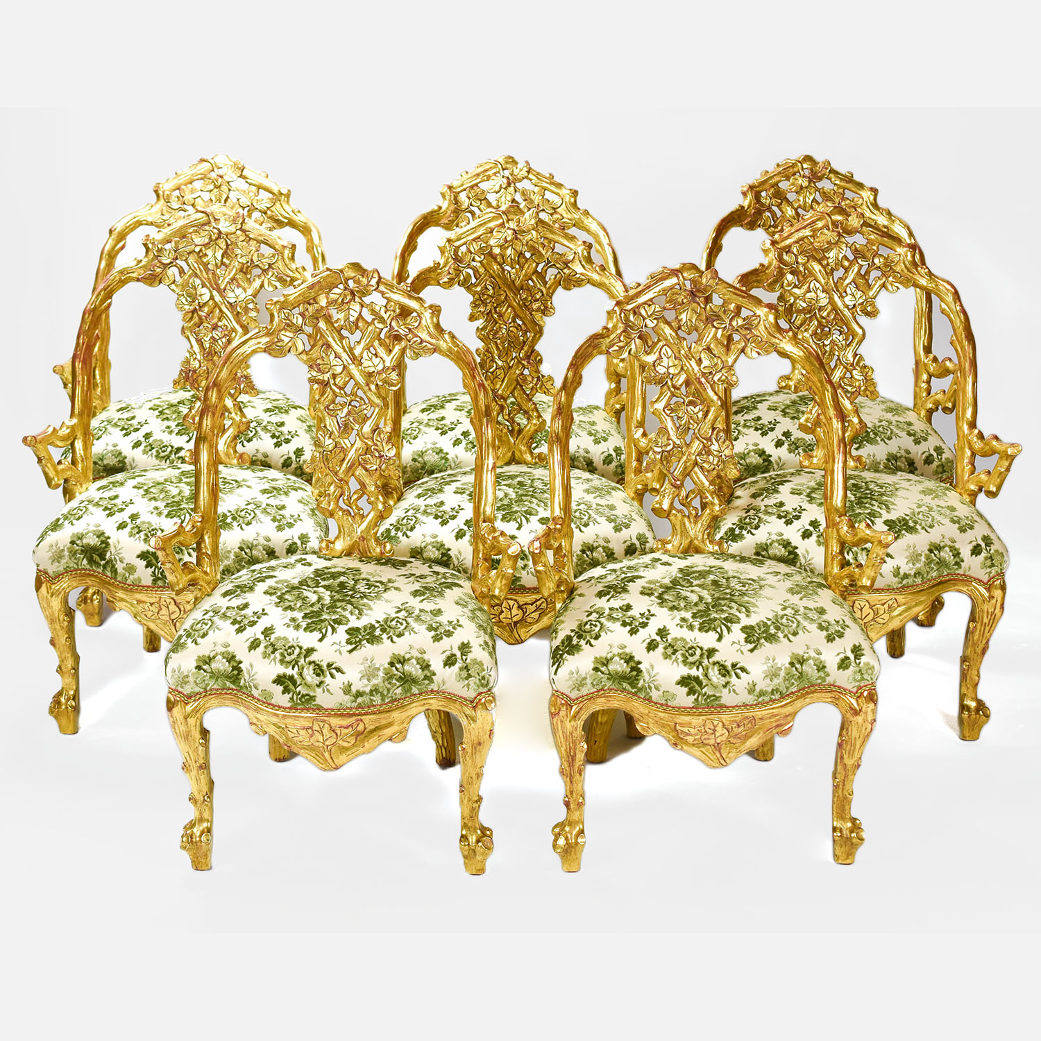 Eight Giltwood Rococo Style Naturalistic Armchairs
